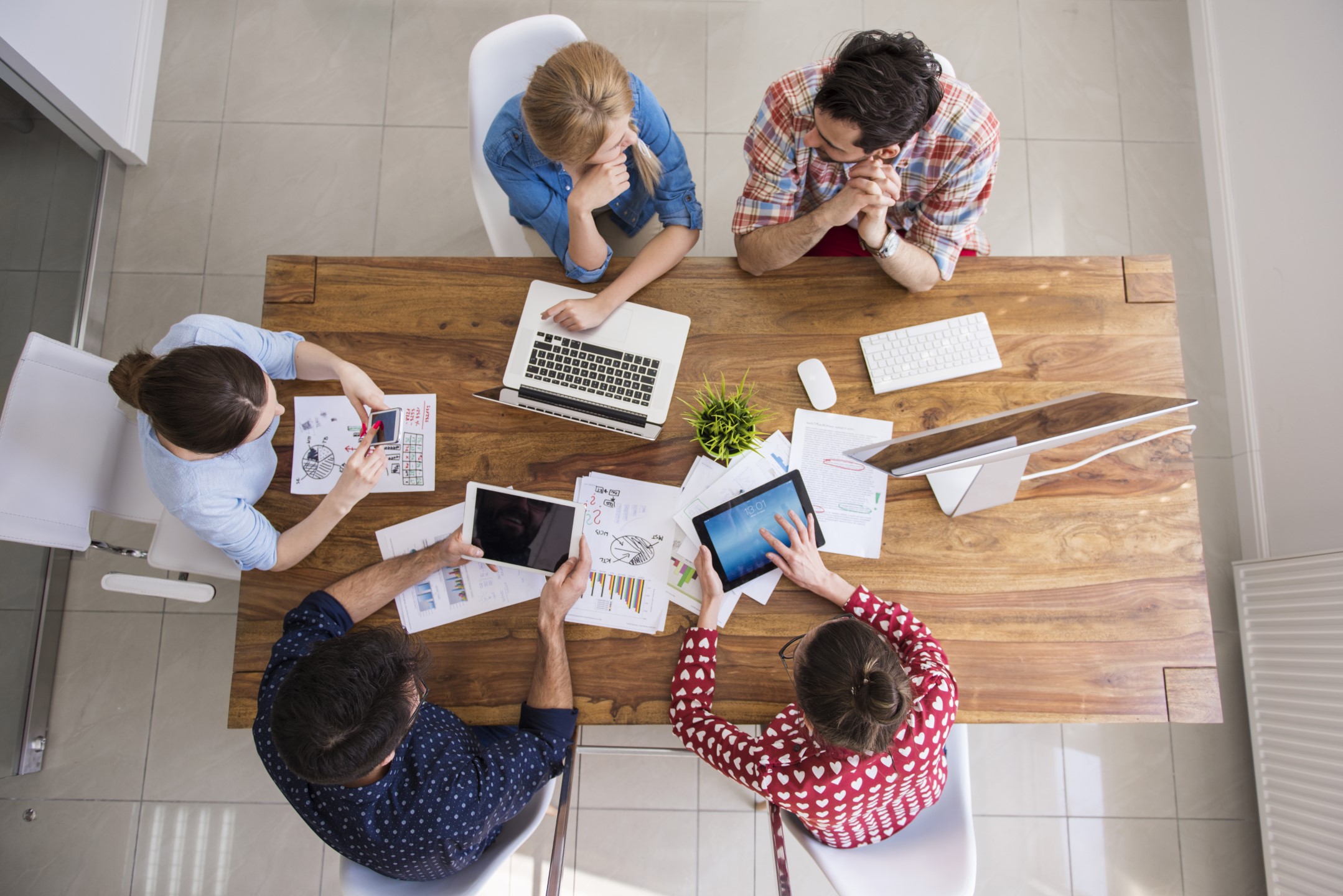 A team sitting at a table working together