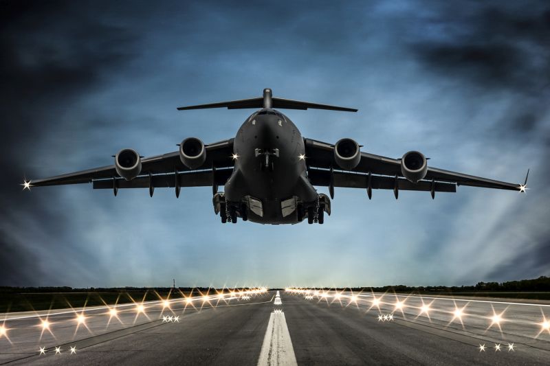 Cargo Airplane landing at dusk